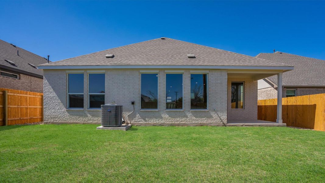 Front exterior of a new home in Rosenbusch Ranch, Leander, TX, highlighting curb appeal (Image 19). Front exterior of a new home in Rosenbusch Ranch, Leander, TX, highlighting curb appeal (Image 19).