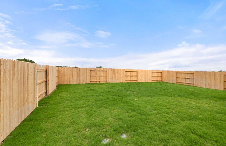 Front exterior of a new home in Patterson Ranch, Georgetown, TX, highlighting curb appeal (Image 2). Front exterior of a new home in Patterson Ranch, Georgetown, TX, highlighting curb appeal (Image 2).