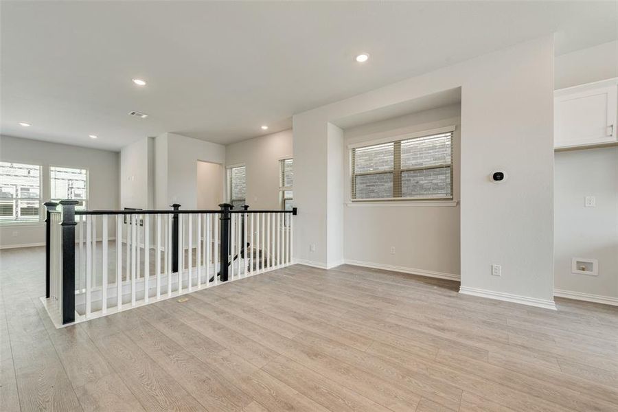 Spare room with light wood-type flooring