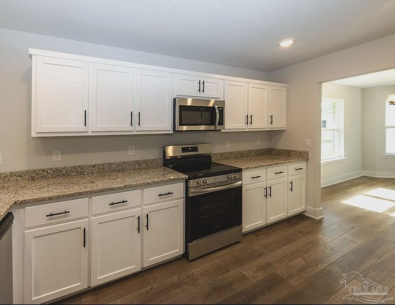 Furnished interior view inside a new home in Hidden Pines, Milton (Image 6).