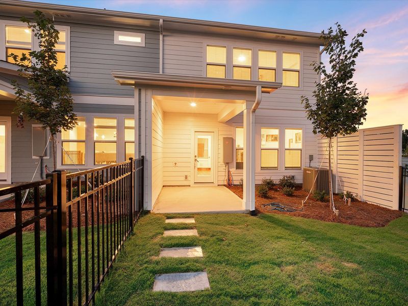 Exterior details and patio area of a home in North Creek Village - Townhomes, Huntersville (Image 4).