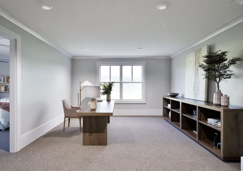 Large upstairs loft decorated as an office with a desk, chair, floor lamp and large shelf.