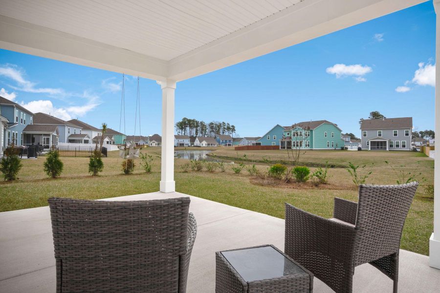Exterior details and patio area of a home in Tidewater at Lakes of Cane Bay, Summerville (Image 27).