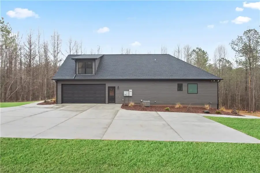 Front exterior of a new home in , Carrollton, GA, highlighting curb appeal (Image 20).