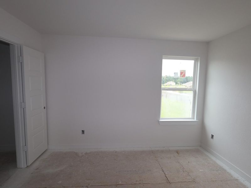 Spacious, unfurnished interior of a new home in Pinewood at Grand Texas, New Caney (Image 11).