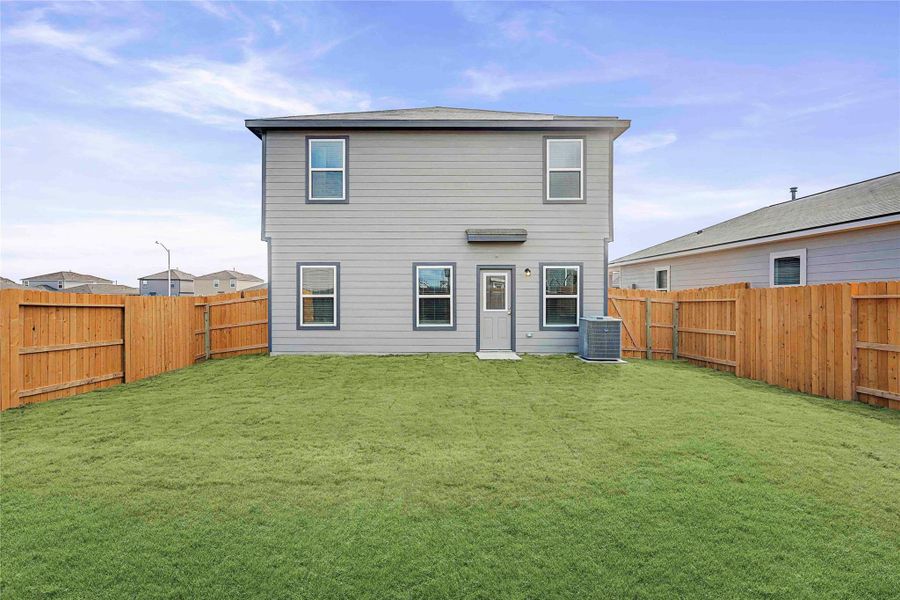A well-maintained fenced yard frames this home's modern exterior. A well-maintained fenced yard frames this home's modern exterior.