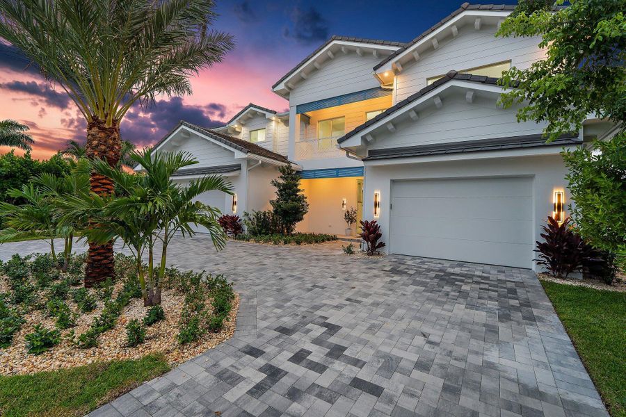 Front exterior of a new home in , Tequesta, FL, highlighting curb appeal (Image 41). Front exterior of a new home in , Tequesta, FL, highlighting curb appeal (Image 41).