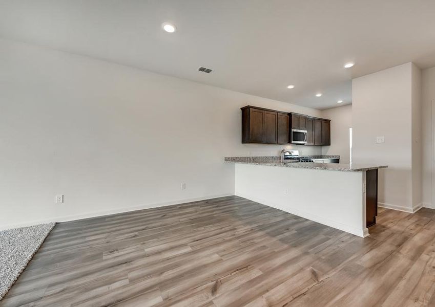 The kitchen is open to the dining room in this spacious, open layout.