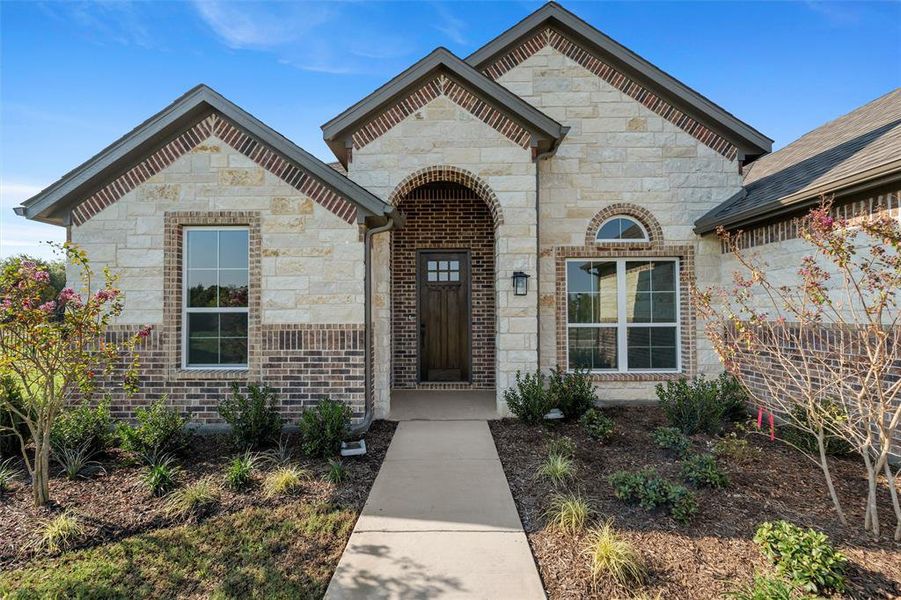 Front exterior of a new home in Vista Oaks Estates, Royse City, TX, highlighting curb appeal (Image 23).