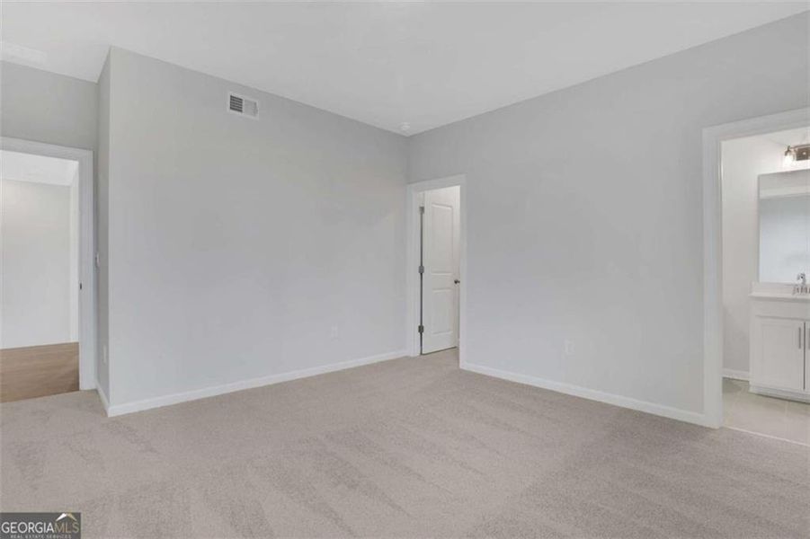 Spacious, unfurnished interior of a new home in The Paddocks at Doc Hughes, Buford (Image 58).