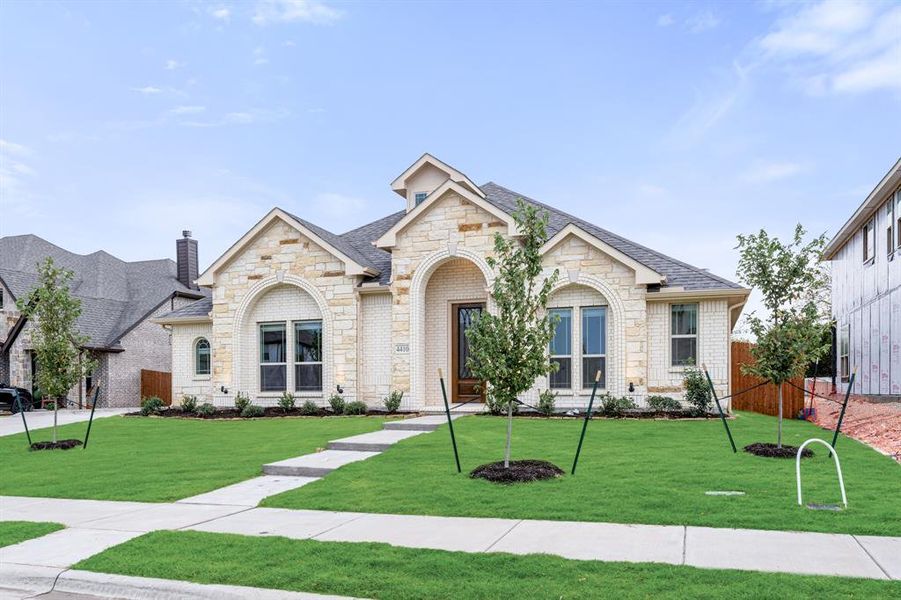 Front exterior of a new home in Ridgepoint, Midlothian, TX, highlighting curb appeal (Image 18). Front exterior of a new home in Ridgepoint, Midlothian, TX, highlighting curb appeal (Image 18).