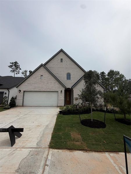 Front exterior of a new home in Evergreen 50', Conroe, TX, highlighting curb appeal (Image 1). Front exterior of a new home in Evergreen 50', Conroe, TX, highlighting curb appeal (Image 1).