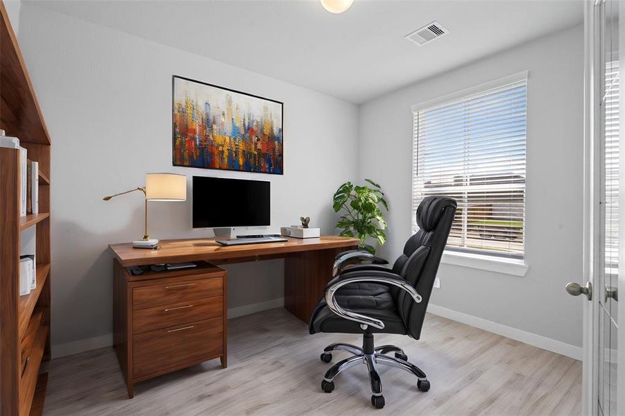 Nestled away quietly in the front of the home is the handsome and grand home office. Featuring neutral paint, beautiful tile flooring and large windows.