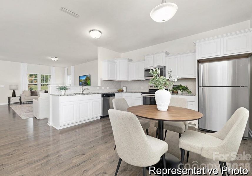 Furnished interior view inside a new home in Whispering Hills, Locust (Image 6).