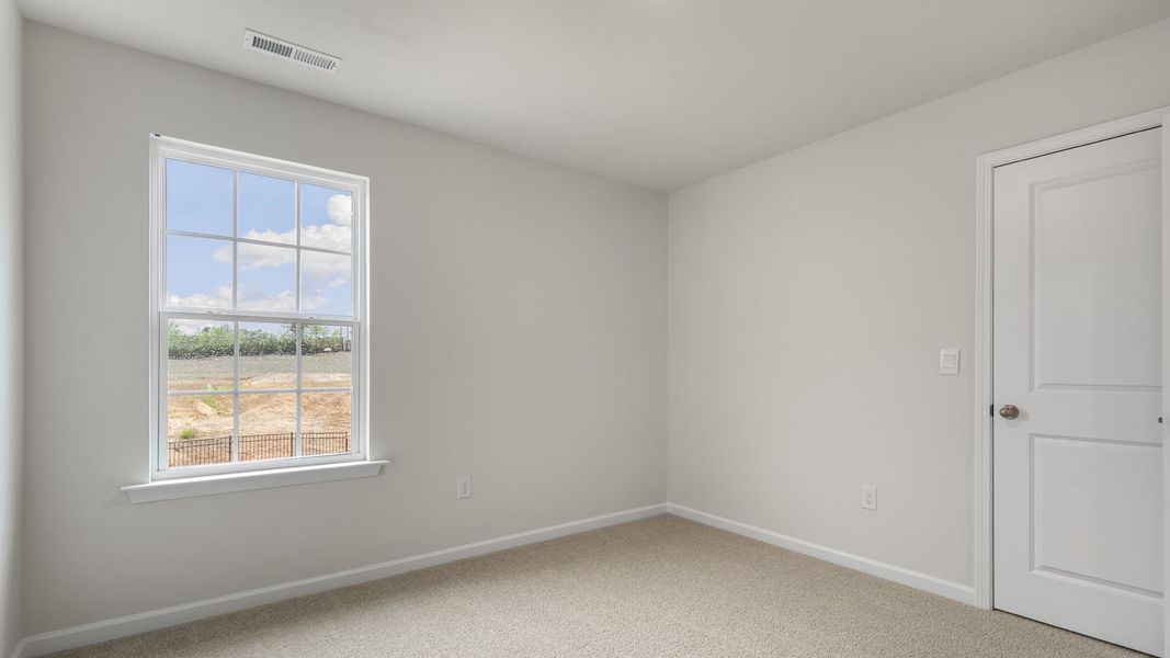 Spacious, unfurnished interior of a new home in The Grove at Matthews Landing, Fuquay Varina (Image 20).
