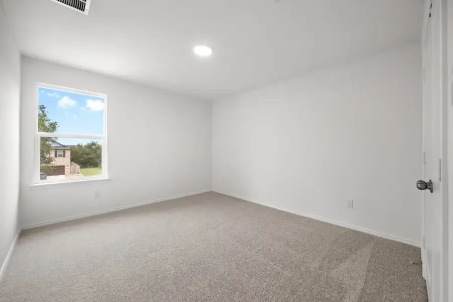 Spacious, unfurnished interior of a new home in River Bluff, Leander (Image 27).