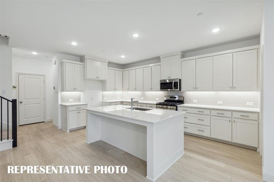 With ample storage and prep space, this kitchen offers everything you have been searching for in a dream kitchen!  REPRESENTATIVE PHOTO.