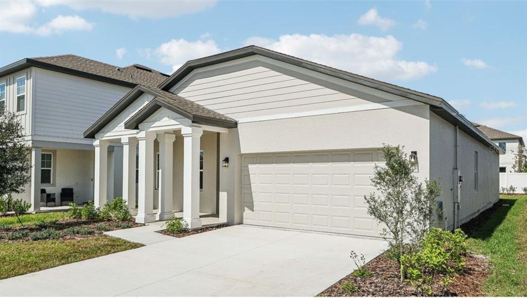 Front exterior of a new home in Sunbrooke, St. Cloud, FL, highlighting curb appeal (Image 17). Front exterior of a new home in Sunbrooke, St. Cloud, FL, highlighting curb appeal (Image 17).
