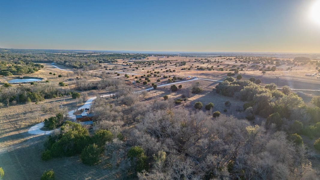 View of property location with rural landscape and a large body of water