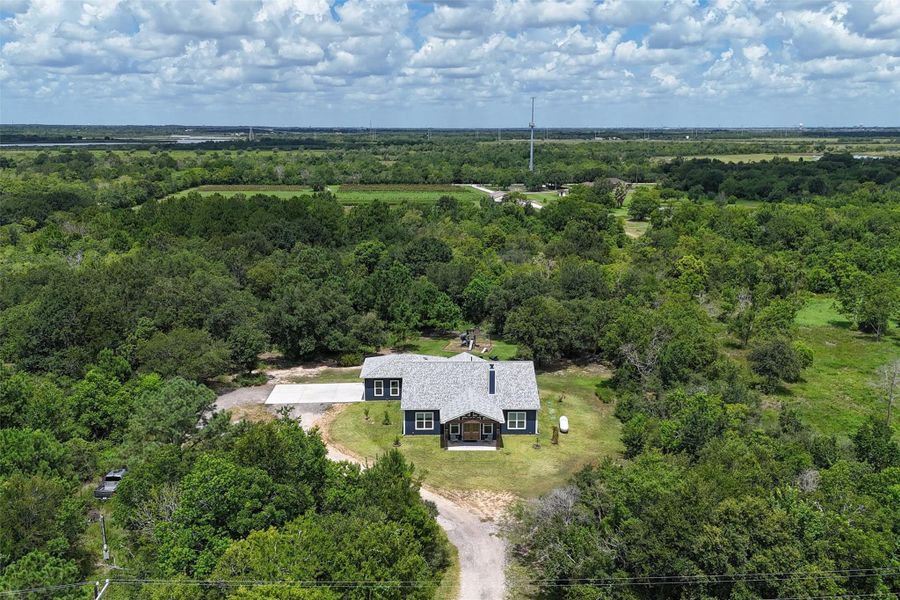 Overhead view of the front of the home. Property backs up to an orchard. Overhead view of the front of the home. Property backs up to an orchard.