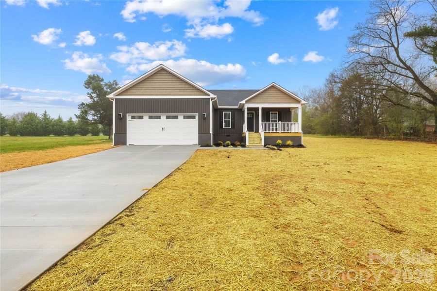 Front exterior of a new home in , Statesville, NC, highlighting curb appeal (Image 17).