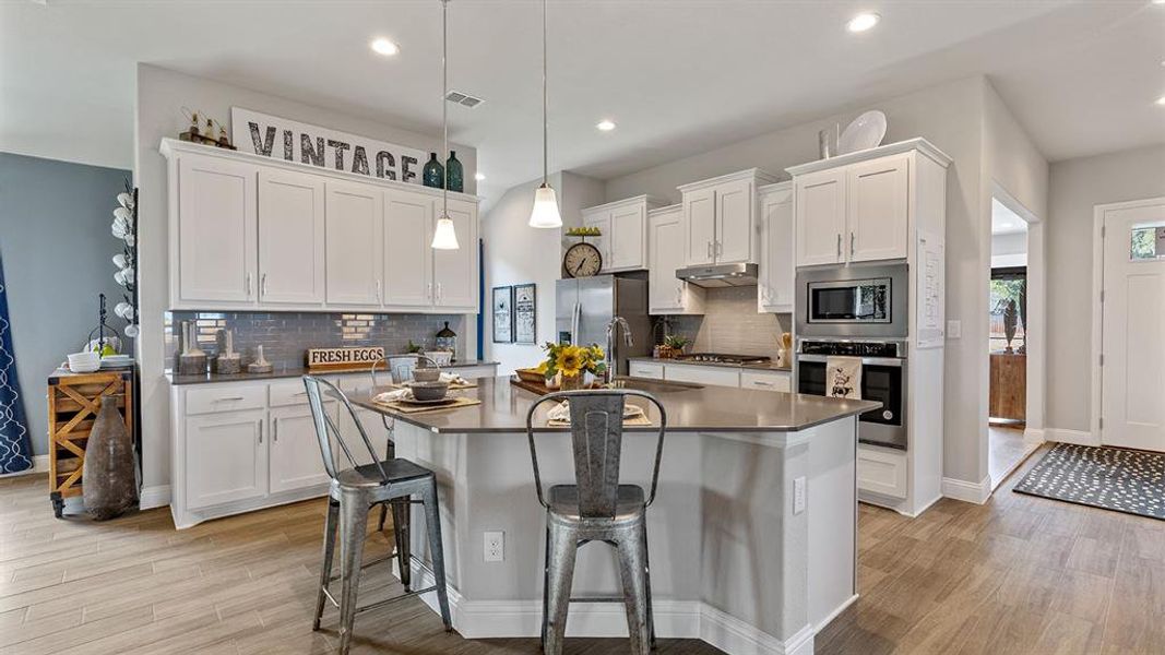 Kitchen - All Home and community information, including pricing, included features, terms, availability and amenities, are subject to change at any time without notice or obligation. All Drawings, pictures, photographs, video, square footages, floor plans, elevations, features, colors and sizes are approximate for illustration purposes only and will vary from the homes as built.