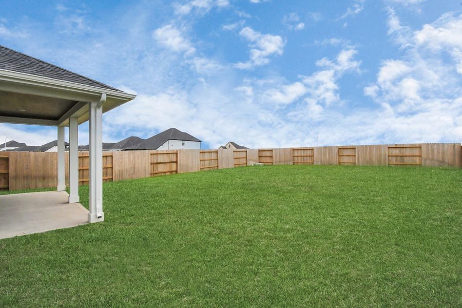 Exterior details and patio area of a home in Sunterra, Katy (Image 3).