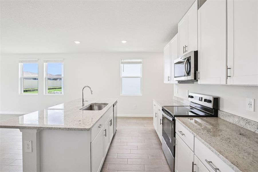Furnished interior view inside a new home in Two Rivers - Premier Series, Zephyrhills (Image 5).