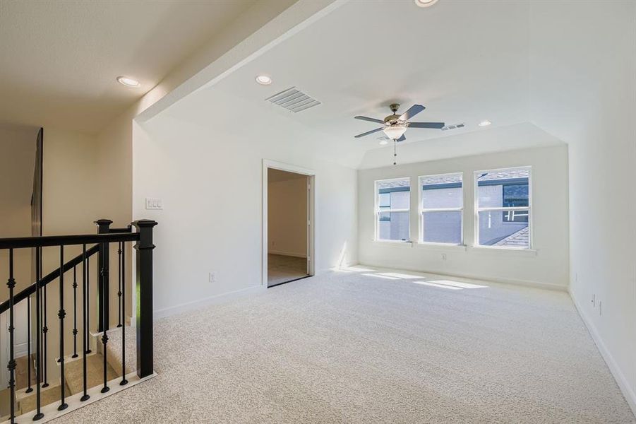 Unfurnished room with recessed lighting, light carpet, and ceiling fan