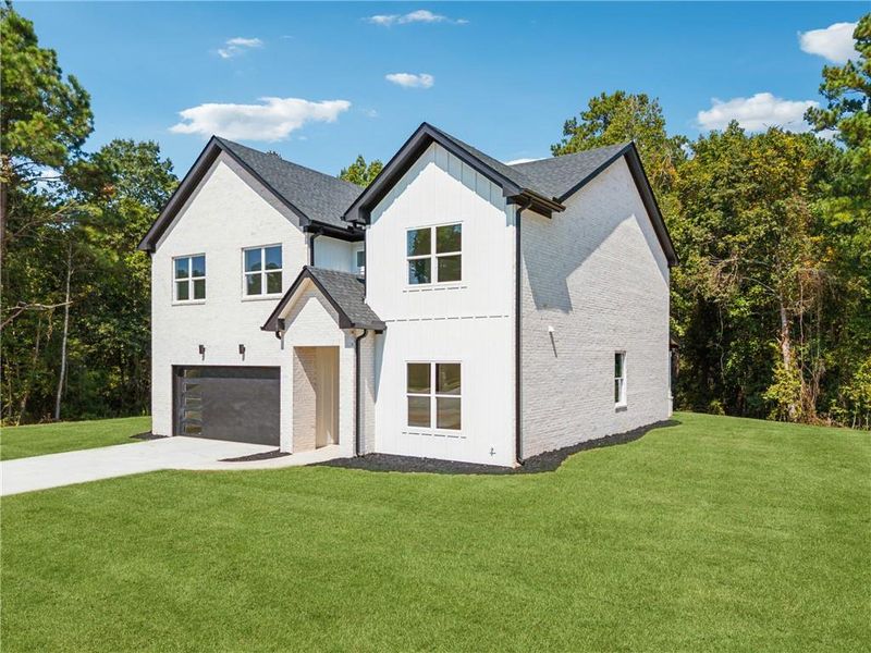 Front exterior of a new home in , Loganville, GA, highlighting curb appeal (Image 24).