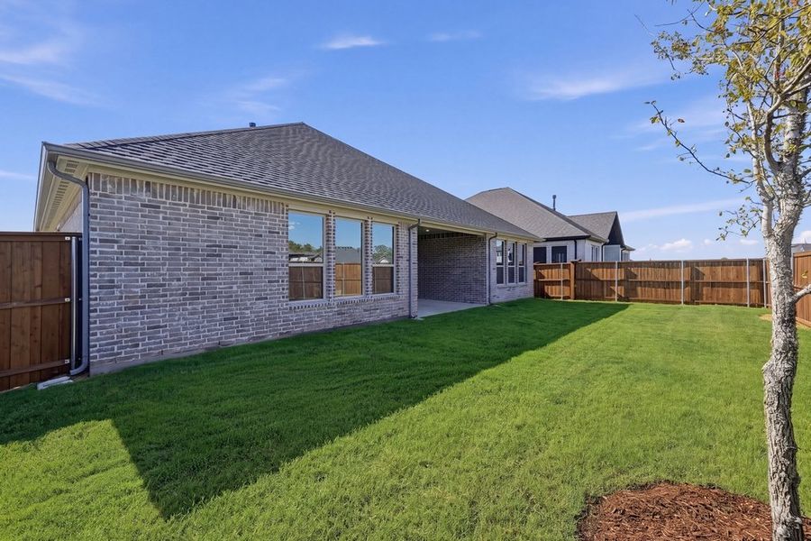 Exterior details and patio area of a home in South Oak, Lakewood Village (Image 3).