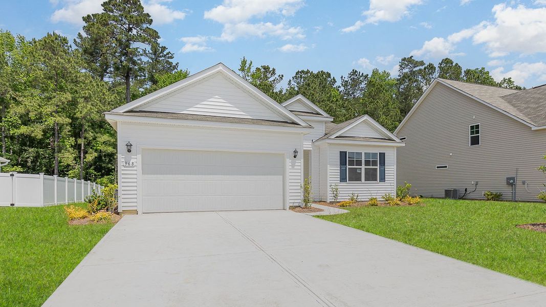 Front exterior of a new home in The Bluffs at Mill Creek, Florence, SC, highlighting curb appeal (Image 2). Front exterior of a new home in The Bluffs at Mill Creek, Florence, SC, highlighting curb appeal (Image 2).