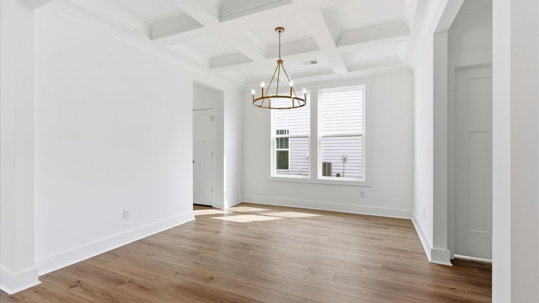 Exclusive dining area with coffered ceiling and refined finishes in a reputable Gray Court, SC location