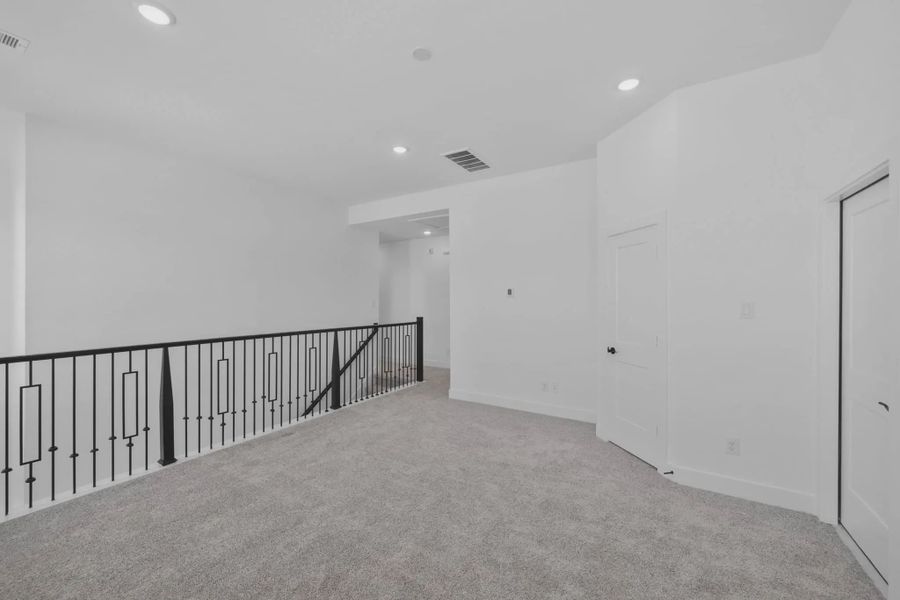Representative unfurnished interior of a home built from the Versailles by Chesmar Homes in Meridiana Chateau, Manvel (Image 45).
