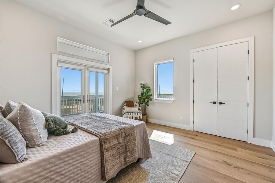 This serene retreat blends luxury and function, with a spacious closet keeping life organized while the room invites relaxation. Imagine lounging here with a book or soaking in quiet moments before stepping out to breathtaking views.