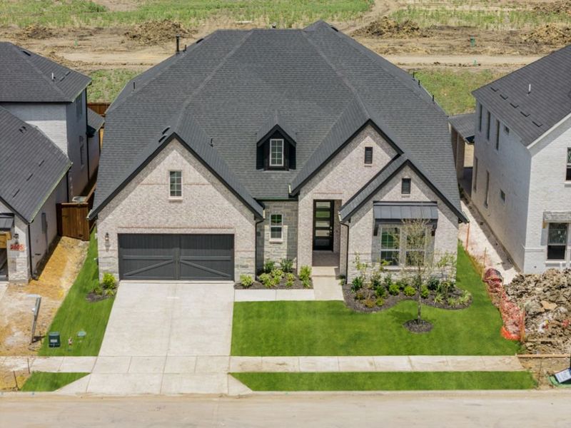Representative exterior photo of a completed home built from the Grayson by UnionMain Homes in Cambridge Crossing, Celina, TX (Image 31).