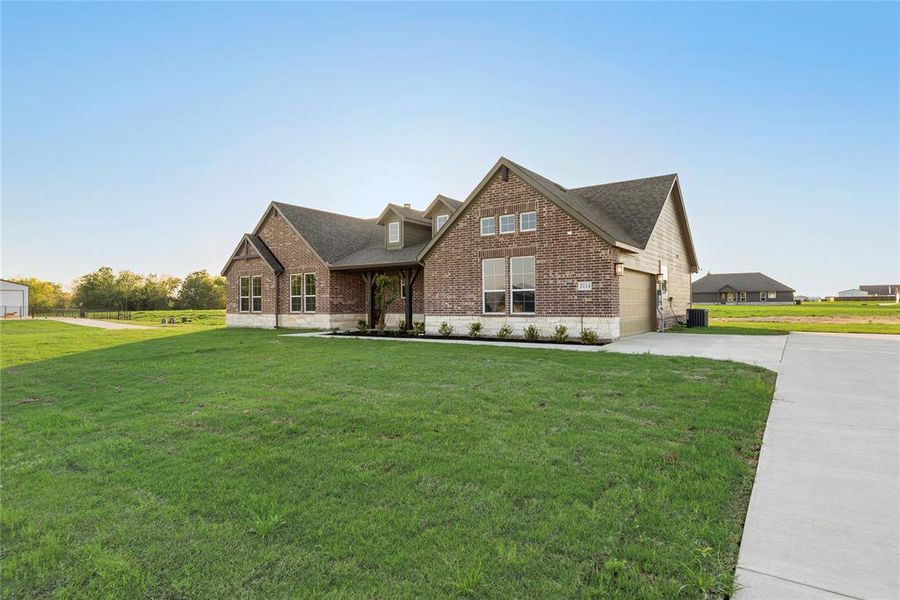 Front exterior of a new home in Oak Valley, Oak Ridge, TX, highlighting curb appeal (Image 29).