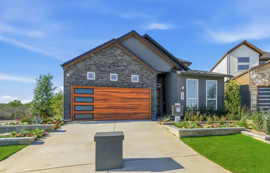 Representative exterior photo of a completed home built from the Talos – HD by Chesmar Homes in Prominence, San Antonio, TX (Image 10). Representative exterior photo of a completed home built from the Talos – HD by Chesmar Homes in Prominence, San Antonio, TX (Image 10).