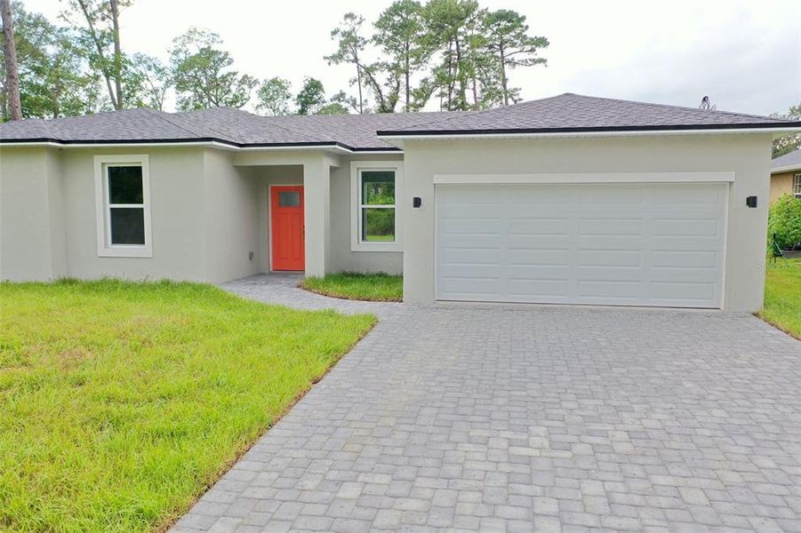 Front exterior of a new home in , Deland, FL, highlighting curb appeal (Image 17).