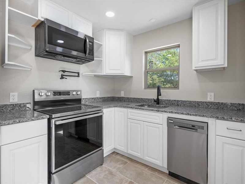 Pot filler over stove and Granite counter tops