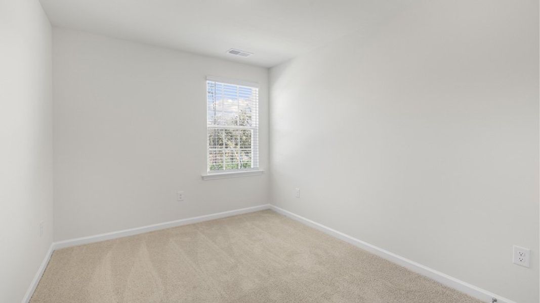 Spacious, unfurnished interior of a new home in The Townes at Galvins Ridge, Sanford (Image 18).