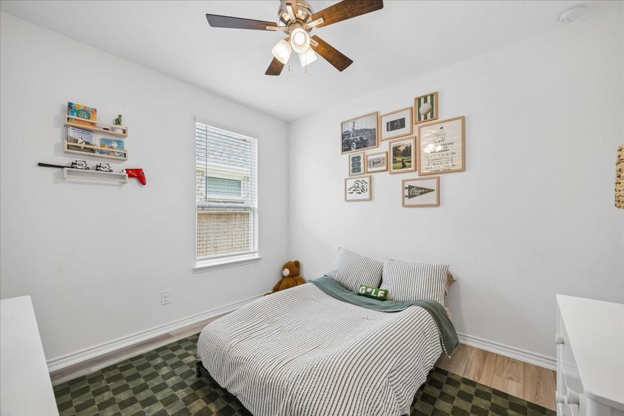 Comfortable guest or family bedroom with great natural light.