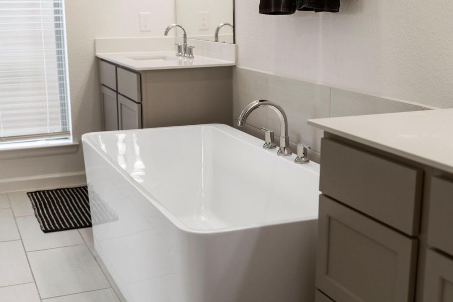 Detail shot of the primary bath's freestanding tub, emphasizing the spa-like quality of the home. Detail shot of the primary bath's freestanding tub, emphasizing the spa-like quality of the home.