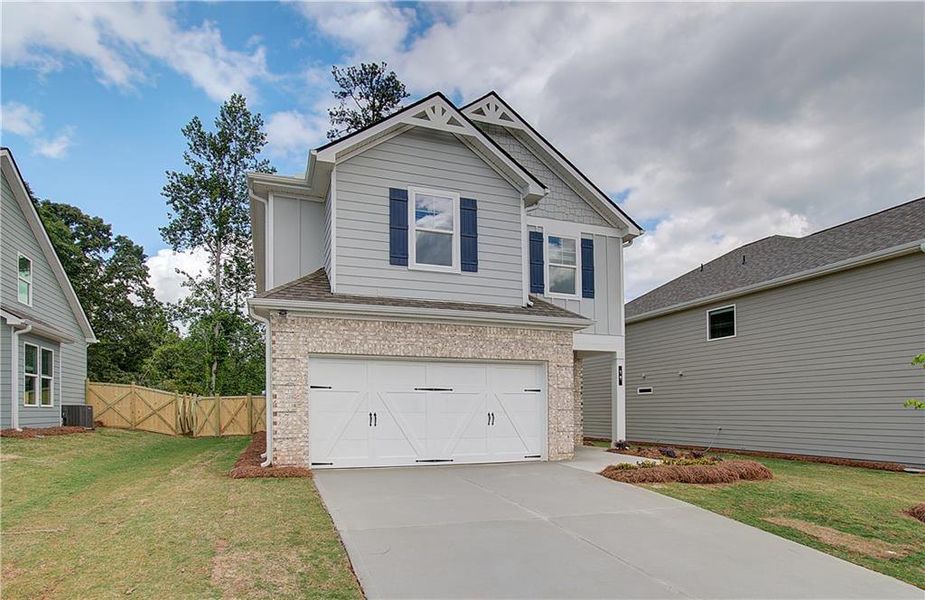 Front exterior of a new home in Enclave at Evergreen, Fairburn, GA, highlighting curb appeal (Image 18).