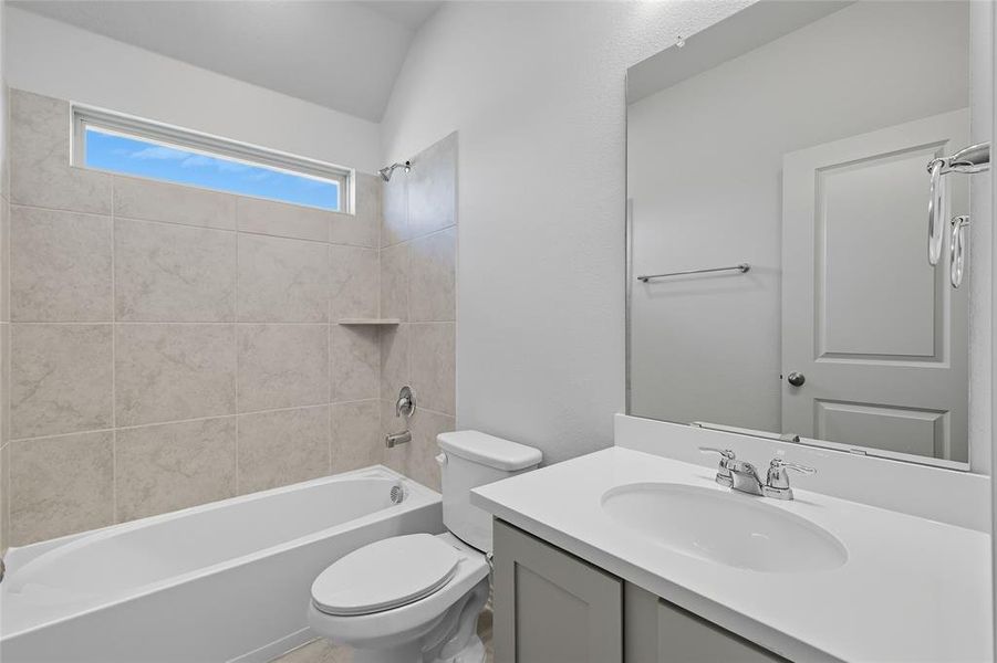 Bathroom featuring vanity and bathtub / shower combination Bathroom featuring vanity and bathtub / shower combination