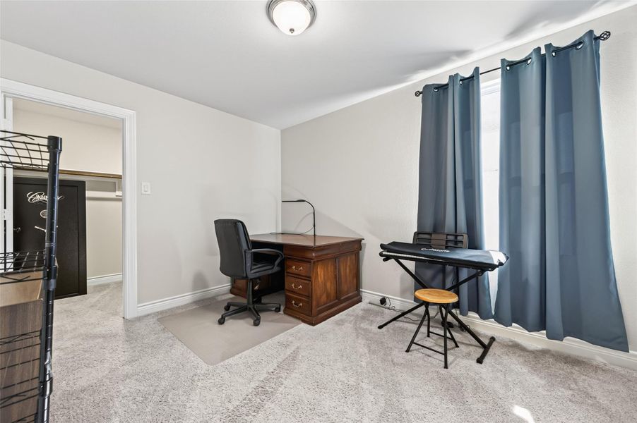 This spacious and inviting fourth bedroom serves as a versatile living space, perfectly suited for a guest suite, a home office, or a comfortable secondary bedroom. The room is highlighted by an expansive, extra-large walk-in closet that provides an abundance of storage capacity for clothing, linens, and personal belongings, helping to maintain a clutter-free and serene living environment. This spacious and inviting fourth bedroom serves as a versatile living space, perfectly suited for a guest suite, a home office, or a comfortable secondary bedroom. The room is highlighted by an expansive, extra-large walk-in closet that provides an abundance of storage capacity for clothing, linens, and personal belongings, helping to maintain a clutter-free and serene living environment.
