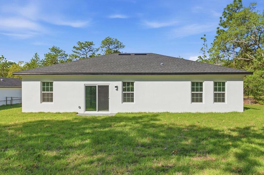 Exterior details and patio area of a home in , Citrus Springs (Image 24).