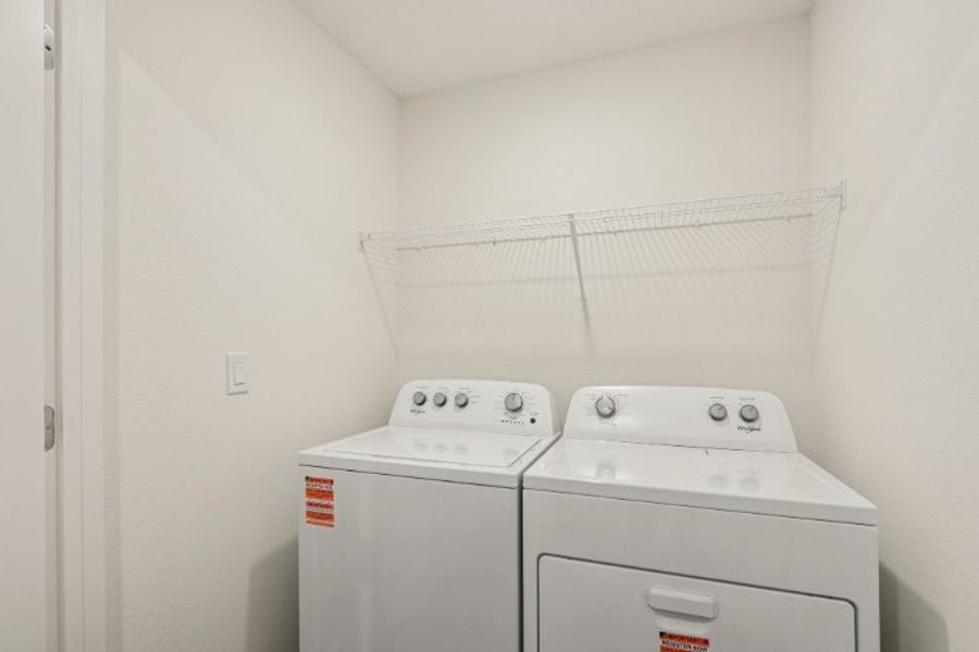 A washing machine in a room.