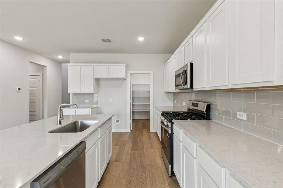 Kitchen in the Winters home plan by Trophy Signature Homes – REPRESENTATIVE PHOTO