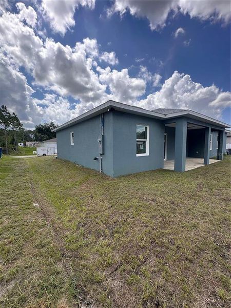 Front exterior of a new home in , Palm Bay, FL, highlighting curb appeal (Image 1). Front exterior of a new home in , Palm Bay, FL, highlighting curb appeal (Image 1).